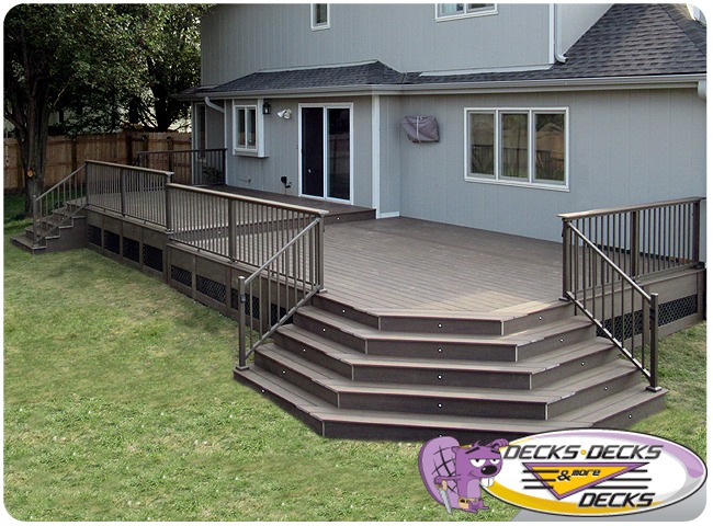 A low maintenance deck with stairs on both ends that lead to the lawn